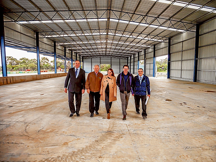 Tip top: Cr Darrel Taylor, left, Cr Colin Hampton, mayor Cr Sandra Mayer, Cr James Dooley and a KTS Recycling representative inspect the site of a new waste transfer station in Skye. Picture: Yanni
