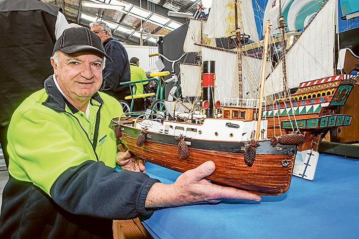 Shed mates ahoy: Chris Lowth at the official opening of the Langwarrin Men’s Shed displays ships he has built. Picture: Gary Sissons