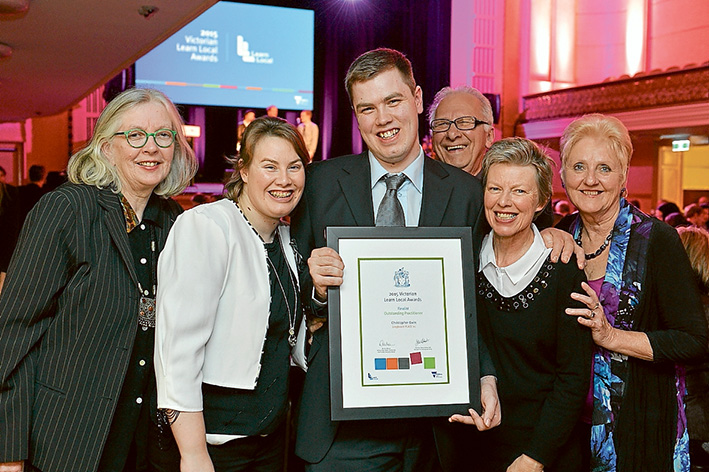 Here to help: IT teacher Chris Ewin, centre, has been recognised for his commitment to showing seniors how to master new technology.