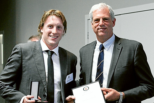 Young gun: Matson Lawson (class of 2010) was the youngest former Peninsula School student inducted into the hall of fame, and received his award from TOPSA committee member Lachlan Patton. Lawson represented Australia in backstroke at the 2012 London Olympics and won his first Australian title in the 200m backstroke in 2013. Picture supplied.
