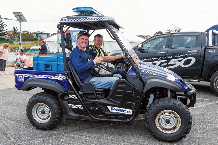 Thumbs up: Kingston police will again patrol beaches in an all-terrain vehicle similar to this buggy out and about at Mates Day at Patterson River last year. Picture: Gary Sissons