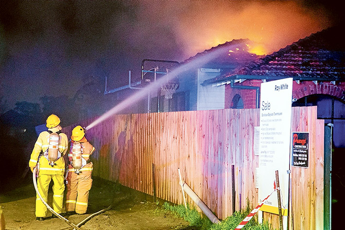 Fire fight: CFA crews tackle the house fire early Saturday. Picture: Gary Sissons