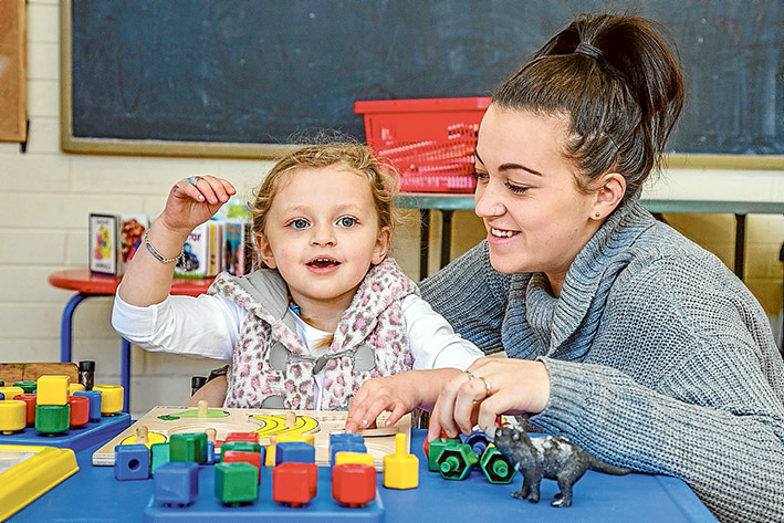 Bright future: Corissa Edwards with young Madi at the Smalltalk Supported Playgroup at Carrum. Picture: Gary Sissons