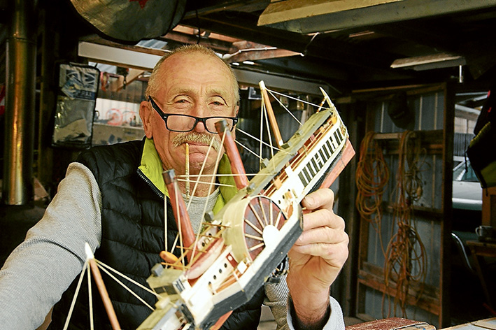 The boatman: Rob Lippiat and one of his models of the historic vessels that once regularly took day trippers around Port Phillip.