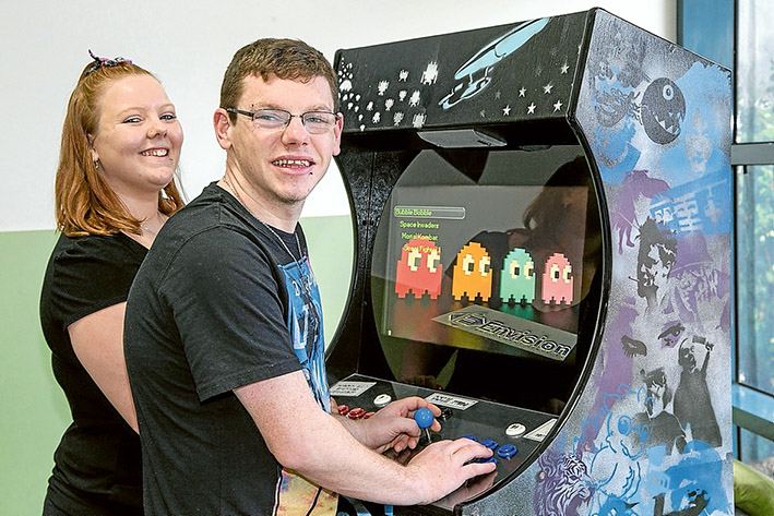 Back to the 80s: Talia Gordon and Peter-John Moller play classic arcade game Pac-Man at Frankston Youth Central. Pic: Gary Sissons