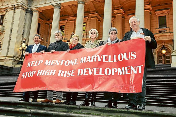 Drastic steps: CR Geoff Gledhill, left, Tony Brooker, Dorothy Booth, Margaret Motram, Sue Blackford and David Banks make their feelings known about a state government intervention to open up the possibility of high-rise development in central Mentone.