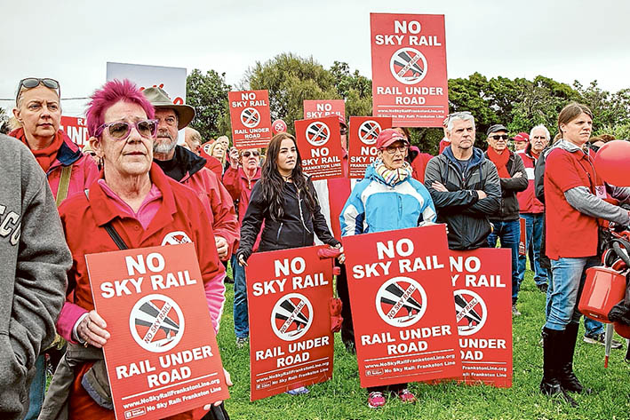 Seeing red: No Sky Rail: Frankston Line marchers gathered on Sunday to protest against elevated rail along the Frankston line. Picture: Gary Sissons