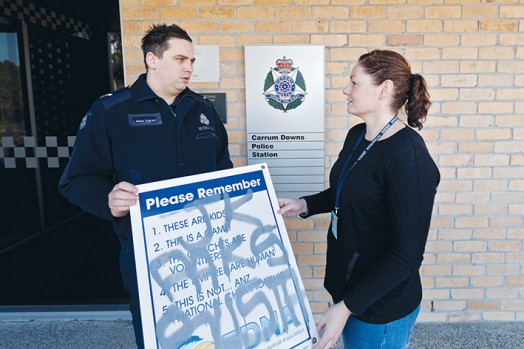 Canned heat: Operation Canned investigators First Constable Catherine Mussared and Constable Adam Pagram display examples of recent graffiti attacks that occurred in the Frankston area.  Picture: Yanni    