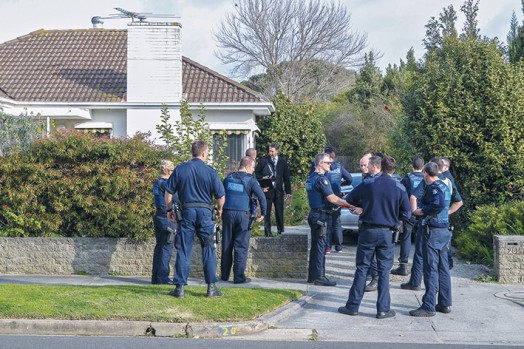 Tense stand-off: Police surrounded a house in Reid St Frankston after an armed man burst in while trying to avoid arrest last Monday afternoon. The elderly occupants of the house fled out the back door and were assisted by police. Pictures: Gary Sissons    