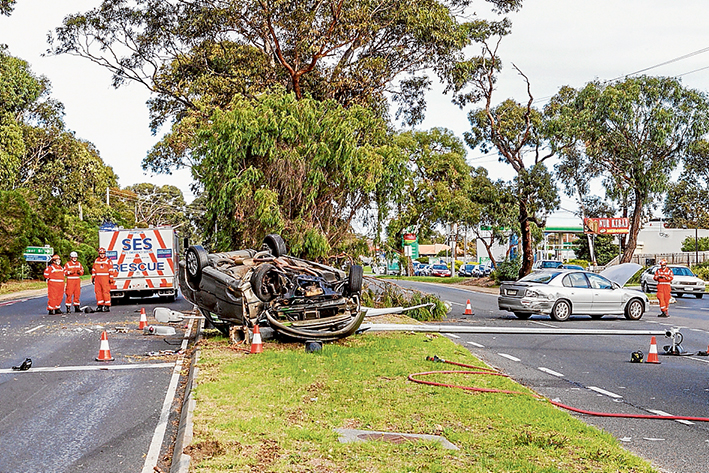 Chaotic scene: Emergency services crews at the scene of Friday’s crash on Frankston-Dandenong Rd. Picture: Gary Sissons