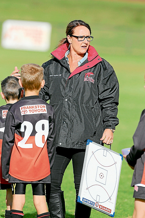 Coaching first: NIC Hough has become the first female coach of a Frankston Dolphins Junior Football Club team, taking charge of the under 9s this season. Picture: Gary Bradshaw