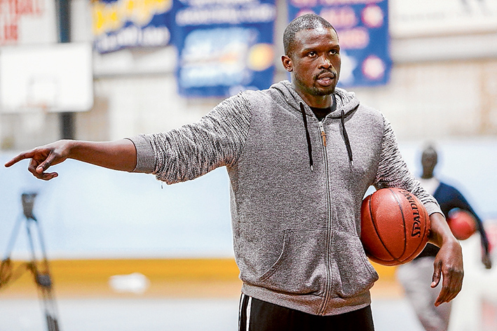 Making a point: NBA all-star and Miami Heat player Luol Deng gives basketball tips at a training session at the Frankston Basketball Stadium. Picture: Gary Sissons