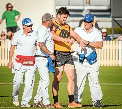 Groggy: Brendan Fevola after a big hit when he played for Ovens & Murray against a Peninsula League side earlier this year. Pic: Michael Kompa Photography