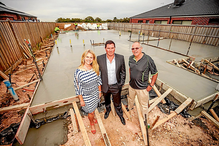 Start of something: Menzies’ Georgia Symmons, Buy Property Direct’s David Brewster and Menzies’ Kevin Johnson at the site of the new house. Picture: Yanni