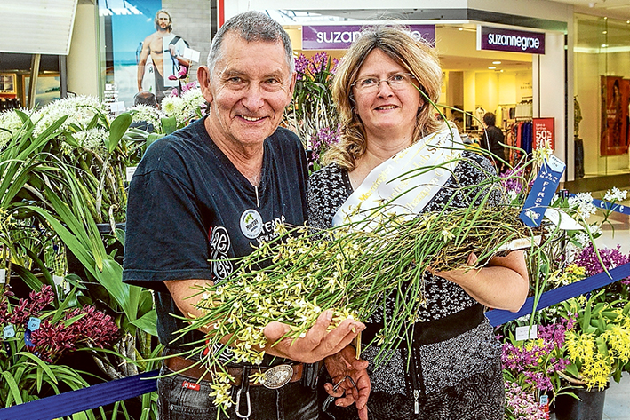 In bloom: Mornington Peninsula Orchid Society members Barry and Marilyn Larkin display orchids at Karingal last month. Picture: Gary Sissons