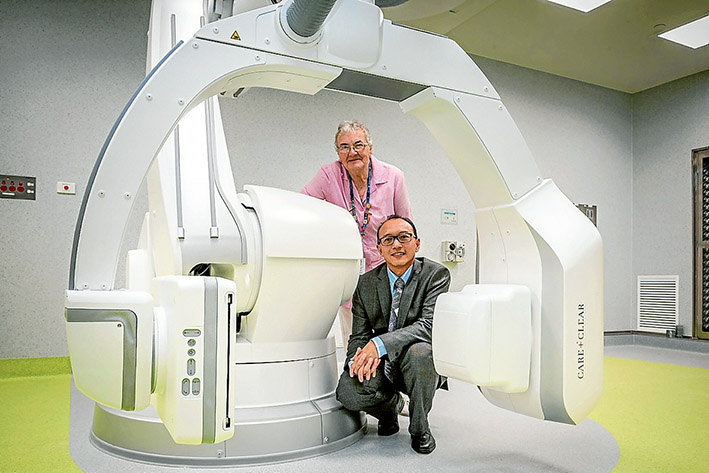 They have the technology: Pink Ladies president Pauline Ellerby and Dr Wai-Leng Chue with a new digital subtraction angiography machine at Frankston Hospital bought thanks to a substantial donation by the Pink Ladies. Picture: Gary Sissons