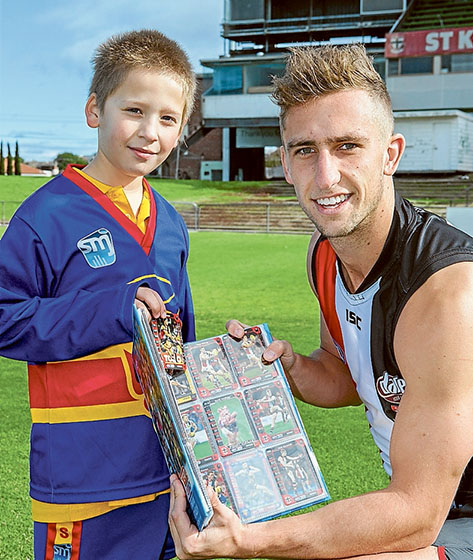 One for the future: Thomas asked St Kilda FC player Luke Dunstan to sign his footy card for his collection when the Saints announced their return to Moorabbin Reserve last year. Picture: Gary Sissons