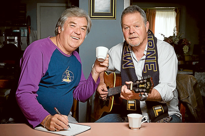 Tuned to success: Lyricist Phil Wall and composer John Mohl play their Melbourne Storm theme song. Picture: Gary Sissons