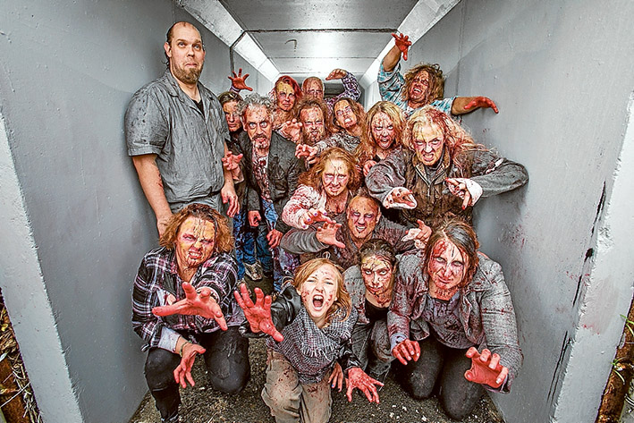 Up zombie creek: Rick Vaveliuk, top left, with a zombie mob assembled for the filming of a short movie in Mordialloc. Picture: Gary Sissons