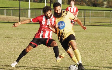 Red mist descends: Mount Eliza’s Nickel Chand (left) pictured with Seaford United’s Isaac Lifu in a round three clash. Chand was sent off during chaotic scenes at Emil Madsen Reserve on Friday night. Picture: Darryl Kennedy
