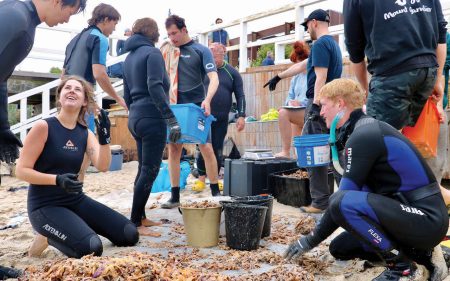 VOLUNTEERS from Earthcare St Kilda at Seaford Pier on Saturday. Picture: Supplied
