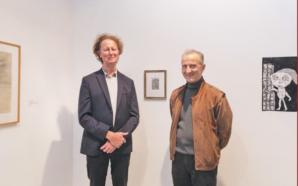 IAN Hay (left) with judge Nick Mourtzakis and his winning drawing ... and somewhere else tomorrow. Picture: Supplied