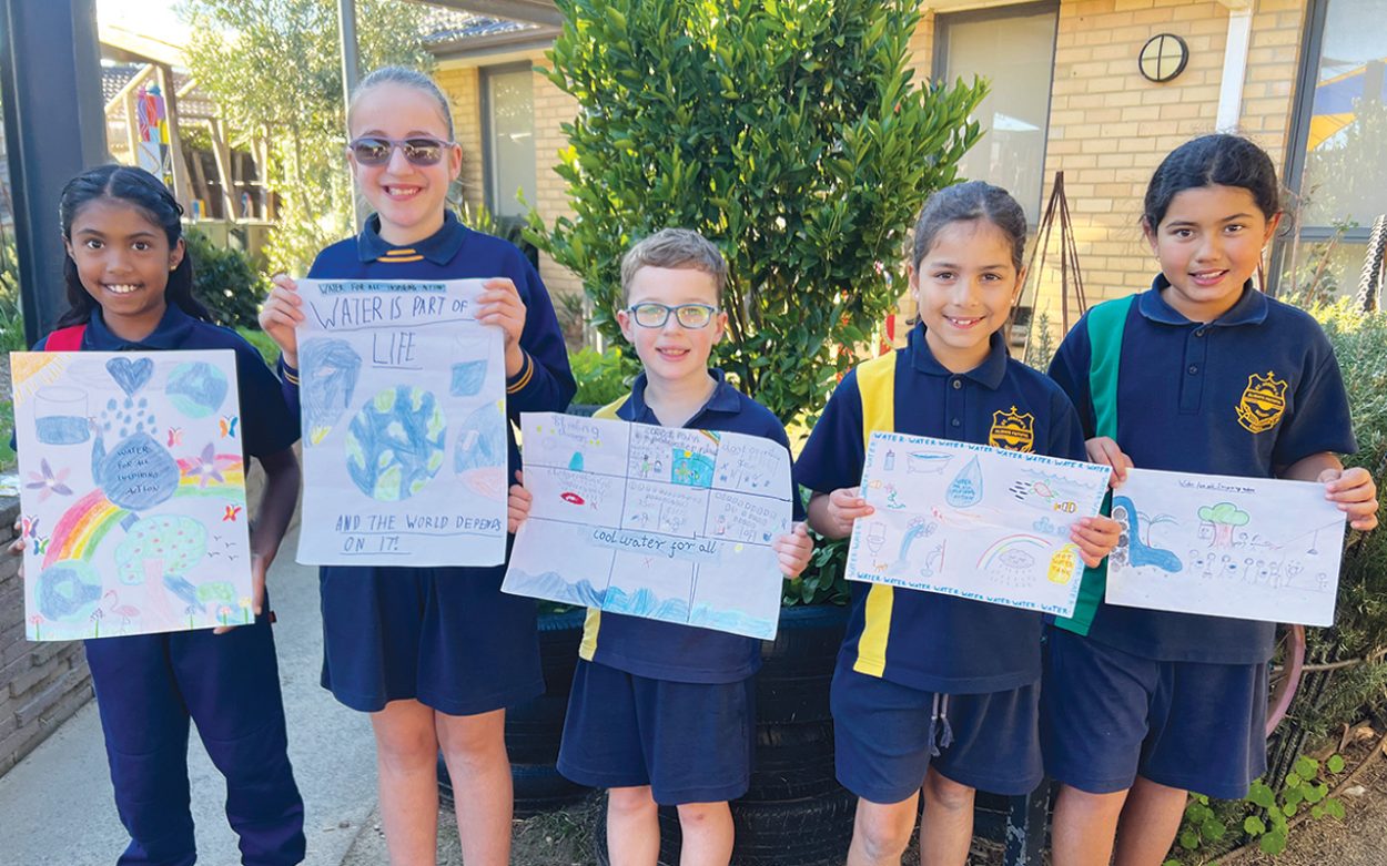 ST Joseph’s Catholic Primary School students Rosie, Amelia, Levi, Catherine, and Layla (L to R) with their entries for the National Water Week poster competition.
