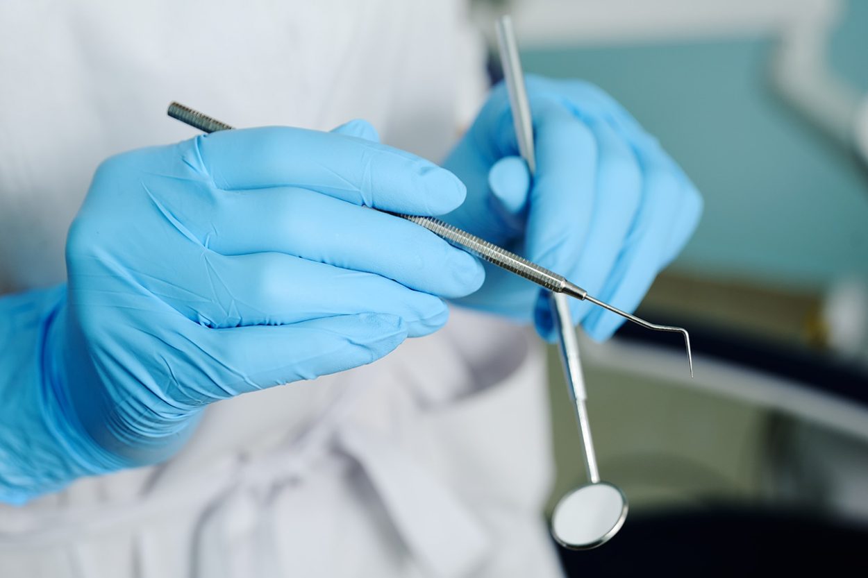 Close-up of dentist hand with dental tools. Picture: AdobeStock